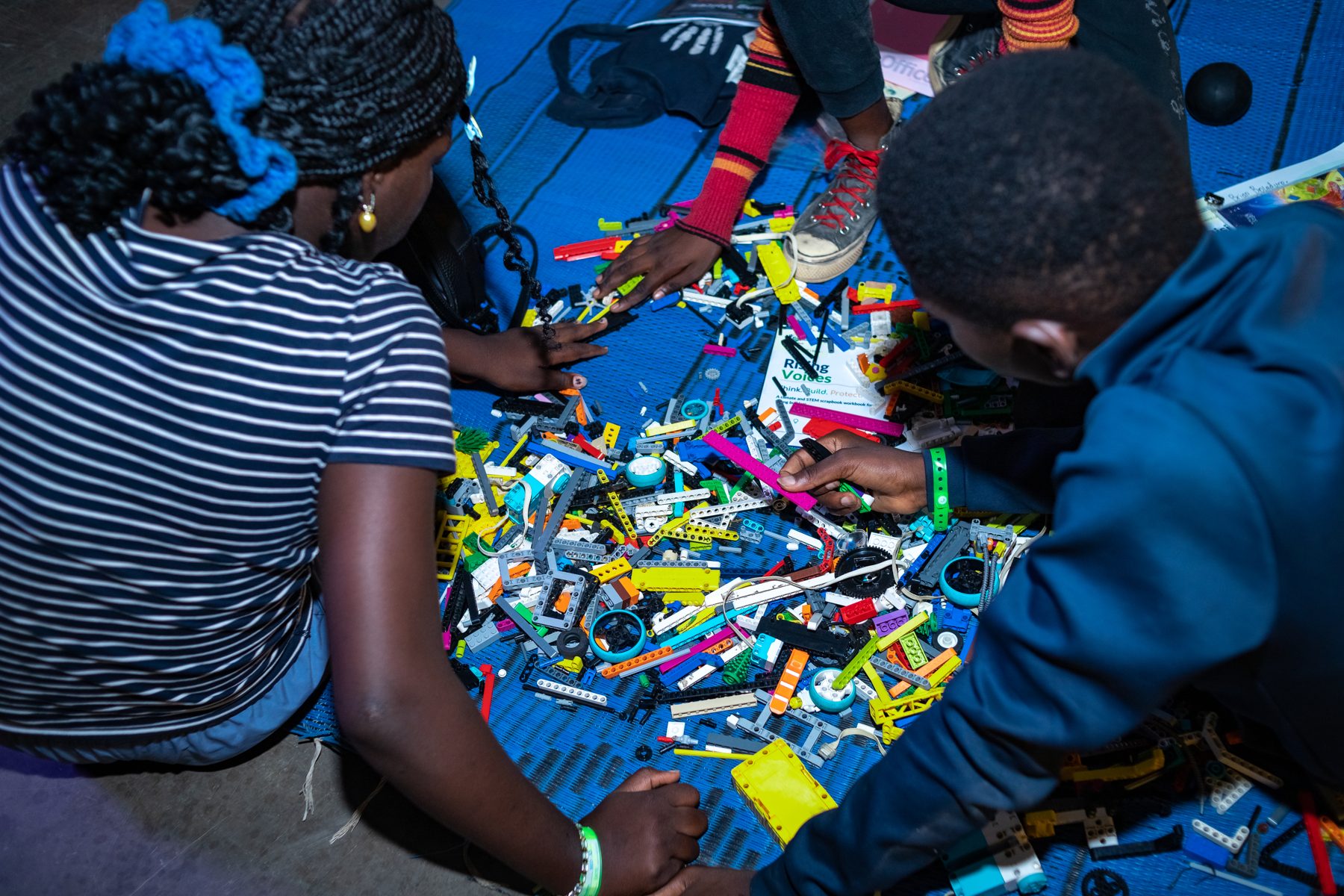 Young people prototyping solutions with LEGO bricks during a CCAIE youth innovation workshop