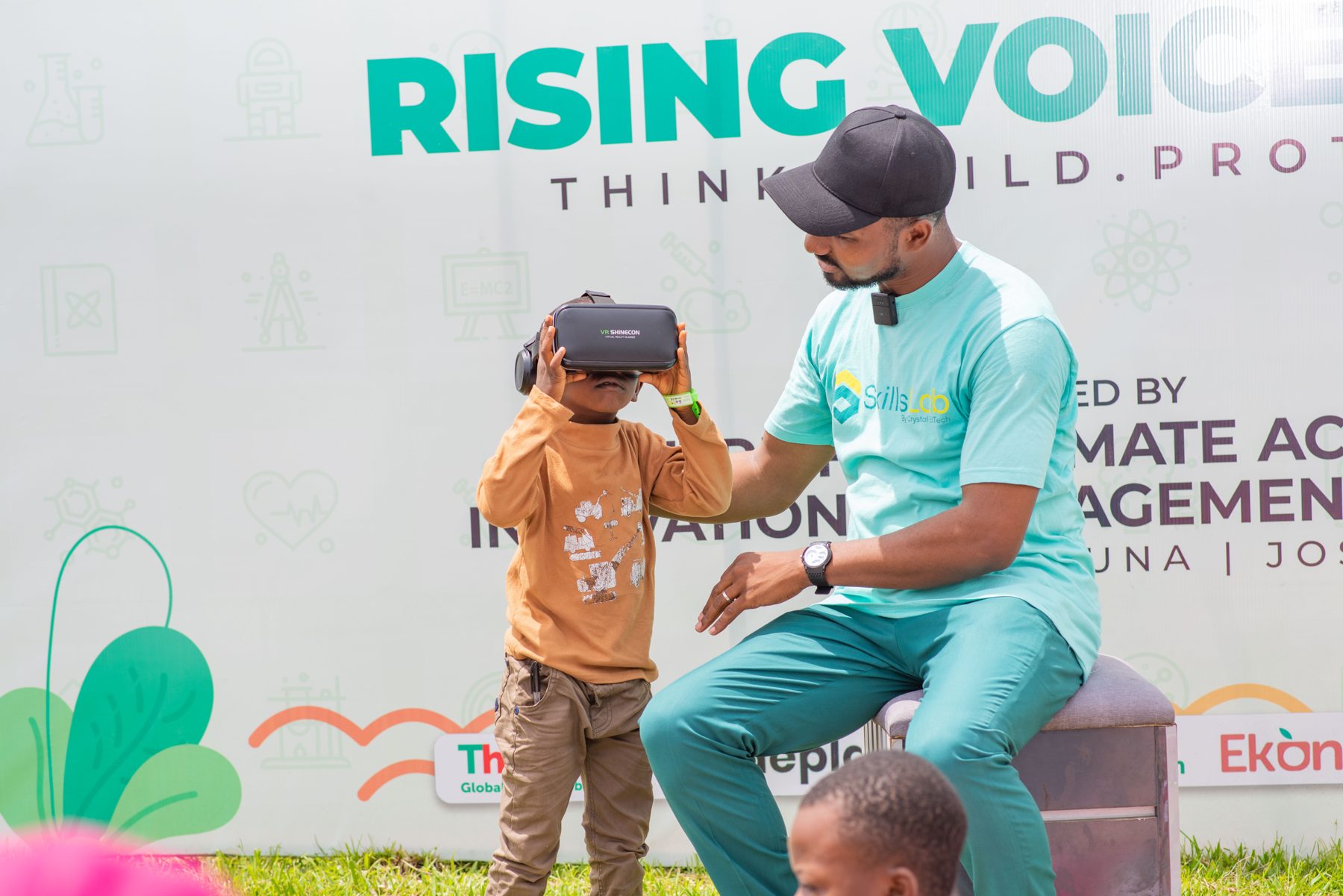 A child trying a climate VR experience at a Rising Voices school session